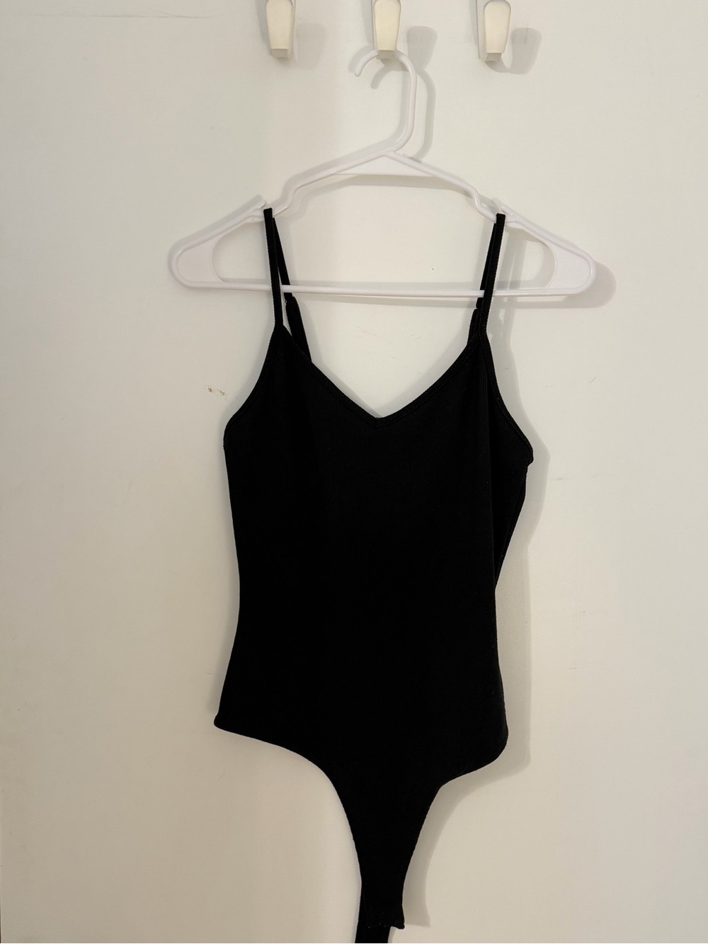 Slim V-Neck Black Bodysuit with Open-Back Detail and Thin Adjustable Straps